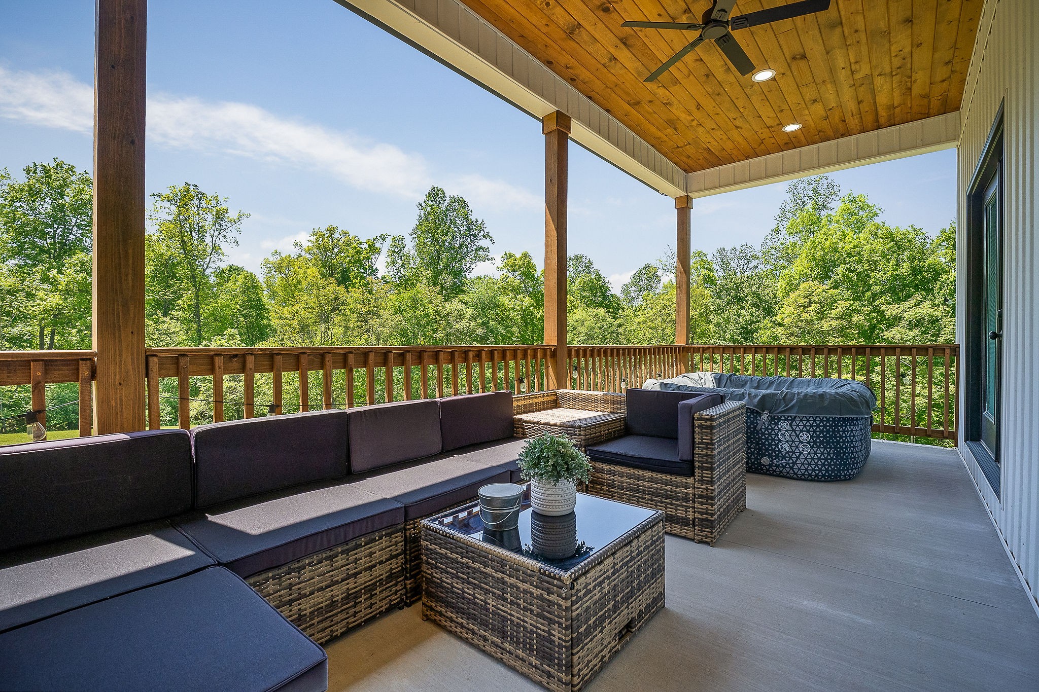 250 Dyer Ridge Road Baxter, TN 38544 - Photo 18 of 52 a roof deck with couches and potted plants