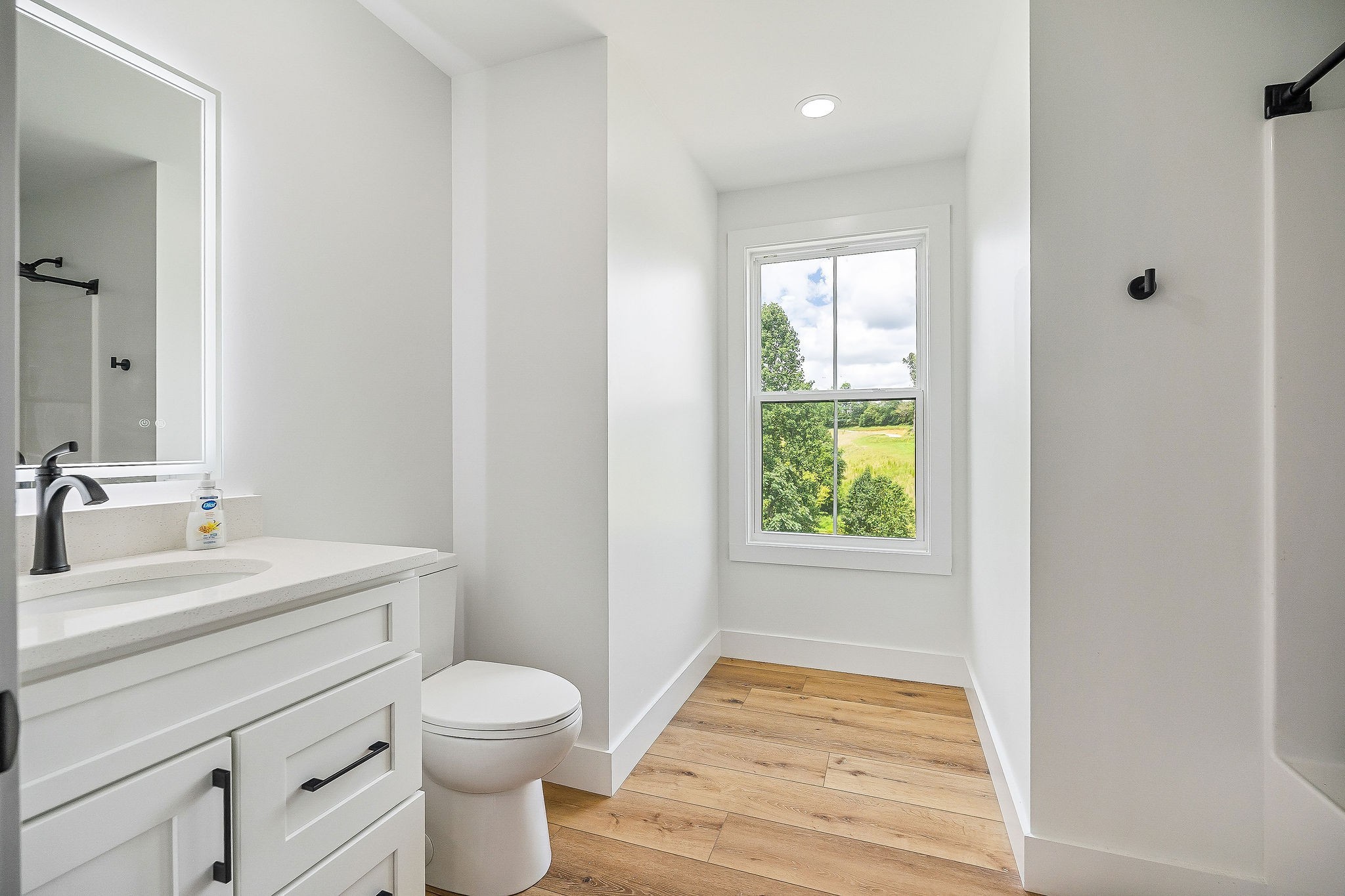 250 Dyer Ridge Road Baxter, TN 38544 - Photo 34 of 52 a bathroom with a sink a toilet and a window