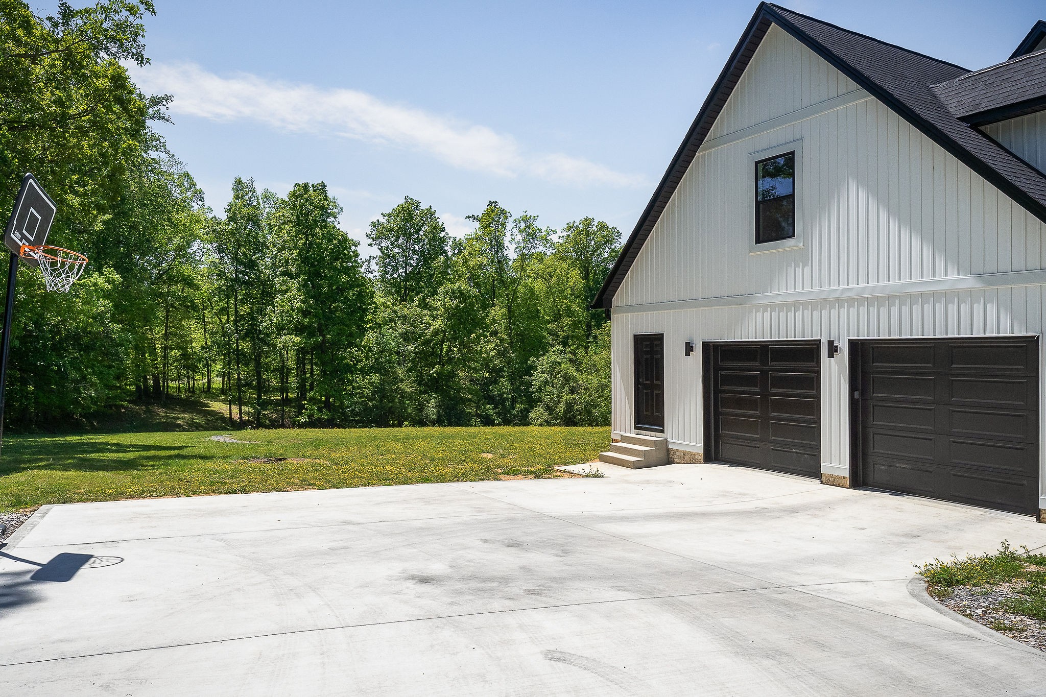250 Dyer Ridge Road Baxter, TN 38544 - Photo 41 of 52 a front view of a house with a yard and garage