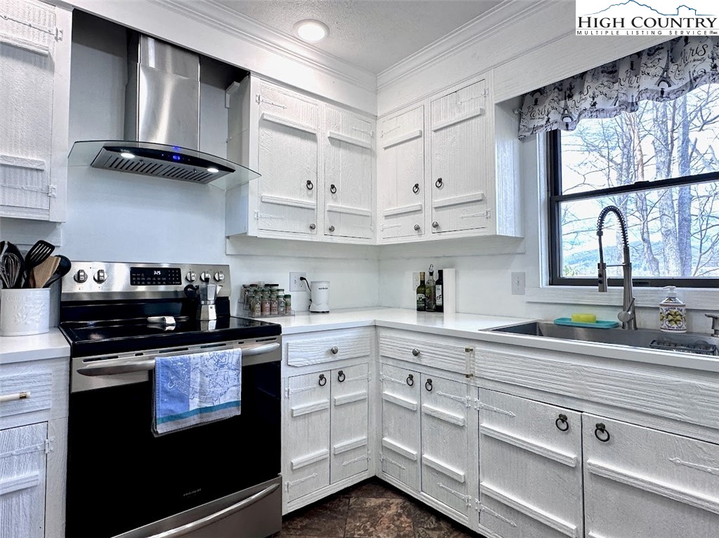 223 Timberlake Sparta, NC 28675 - Photo 13 of 50 a kitchen with cabinets appliances and a window