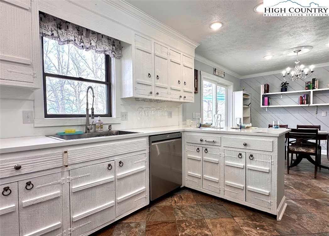 223 Timberlake Sparta, NC 28675 - Photo 16 of 50 a kitchen with white cabinets and window