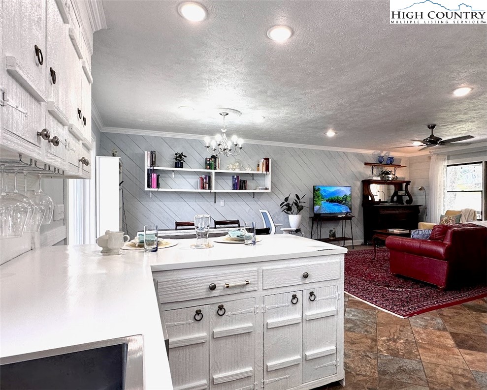 223 Timberlake Sparta, NC 28675 - Photo 17 of 50 a room with furniture a flat screen tv and a dresser