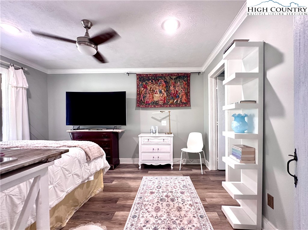 223 Timberlake Sparta, NC 28675 - Photo 25 of 50 a bedroom with a bed and a television