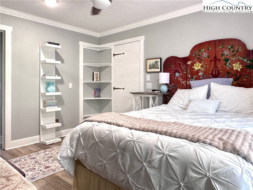 223 Timberlake Sparta, NC 28675 - Photo 26 of 50 a bedroom with a large bed and a window