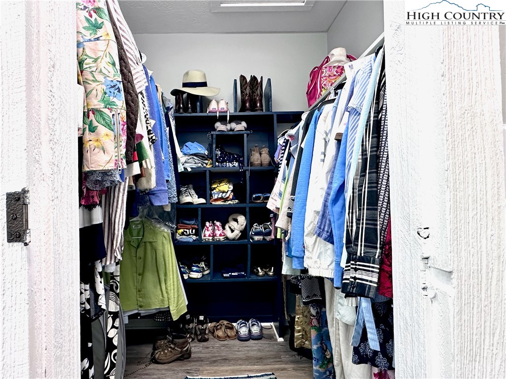 223 Timberlake Sparta, NC 28675 - Photo 29 of 50 a view of walk in closet with clothes and shoes