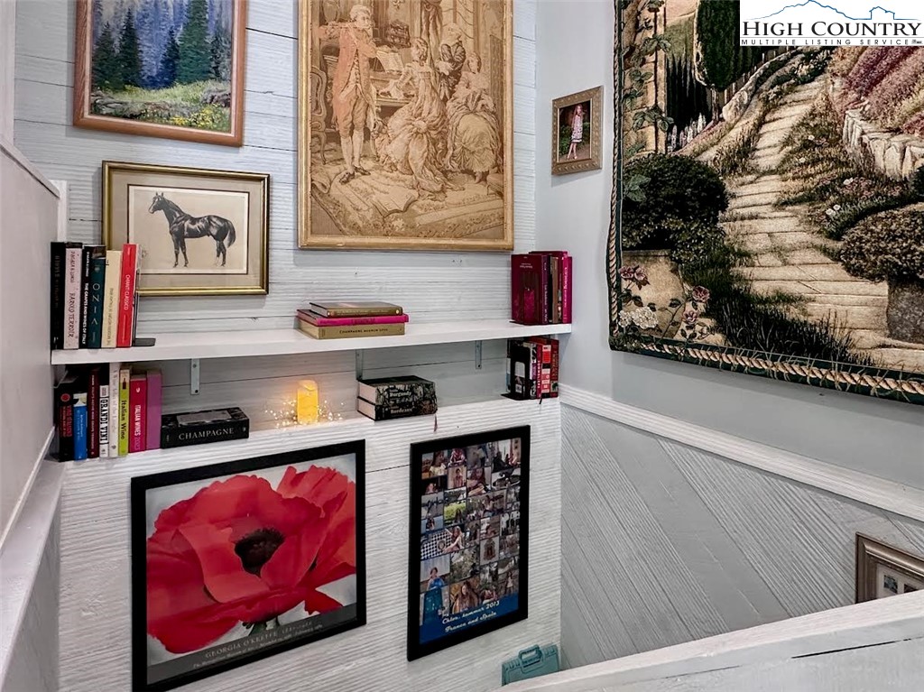 223 Timberlake Sparta, NC 28675 - Photo 34 of 50 a room with lots of books and a painting on the wall