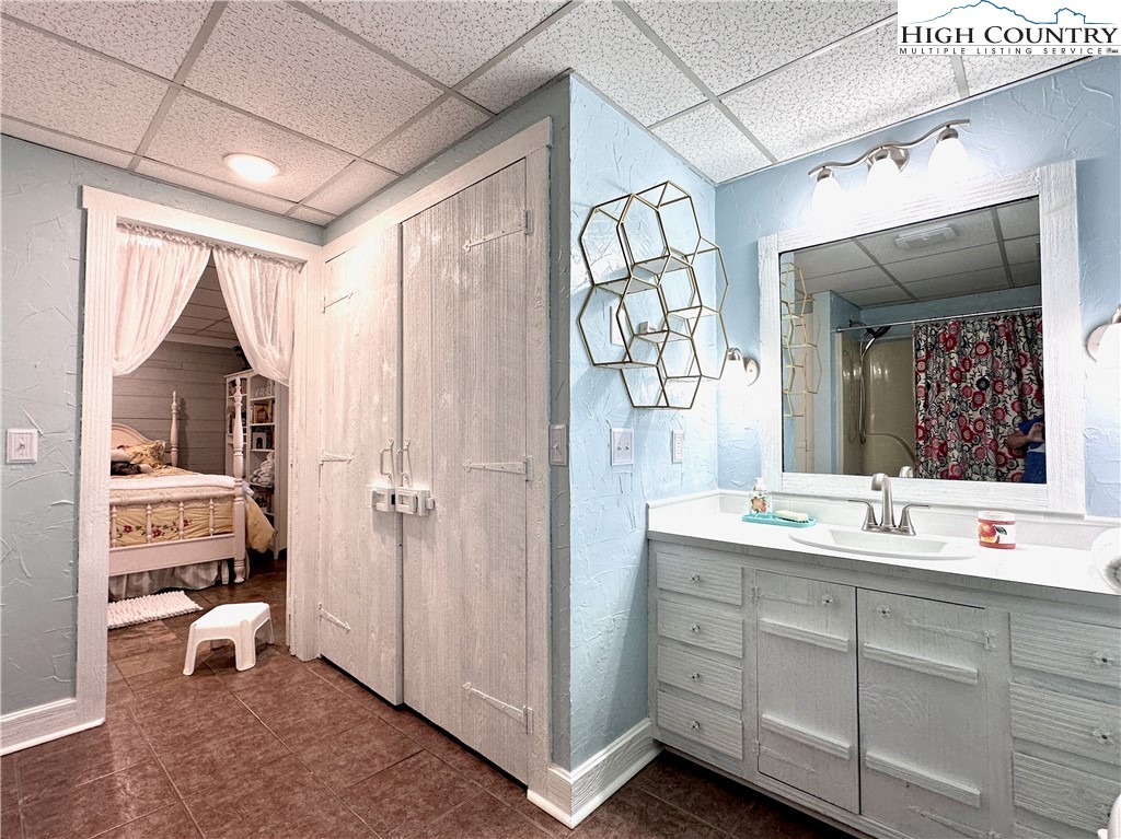 223 Timberlake Sparta, NC 28675 - Photo 36 of 50 a bathroom with a sink and a mirror