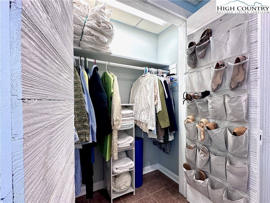223 Timberlake Sparta, NC 28675 - Photo 38 of 50 a view of walk in closet with clothes and shoes