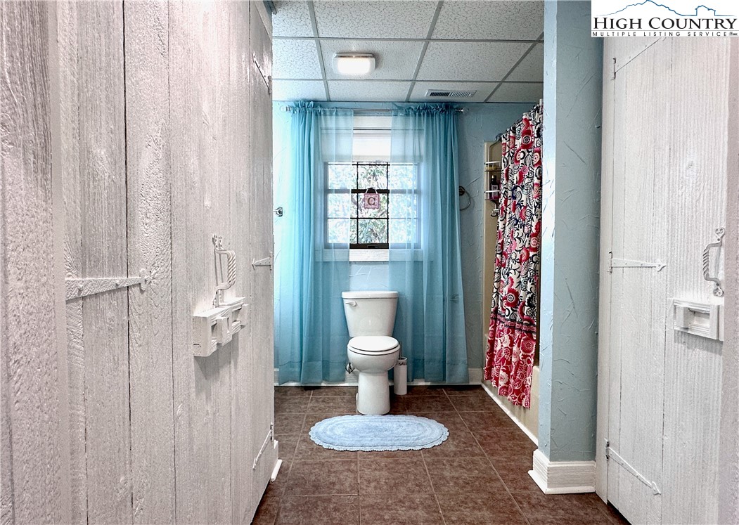 223 Timberlake Sparta, NC 28675 - Photo 39 of 50 a bathroom with a sink toilet and shower