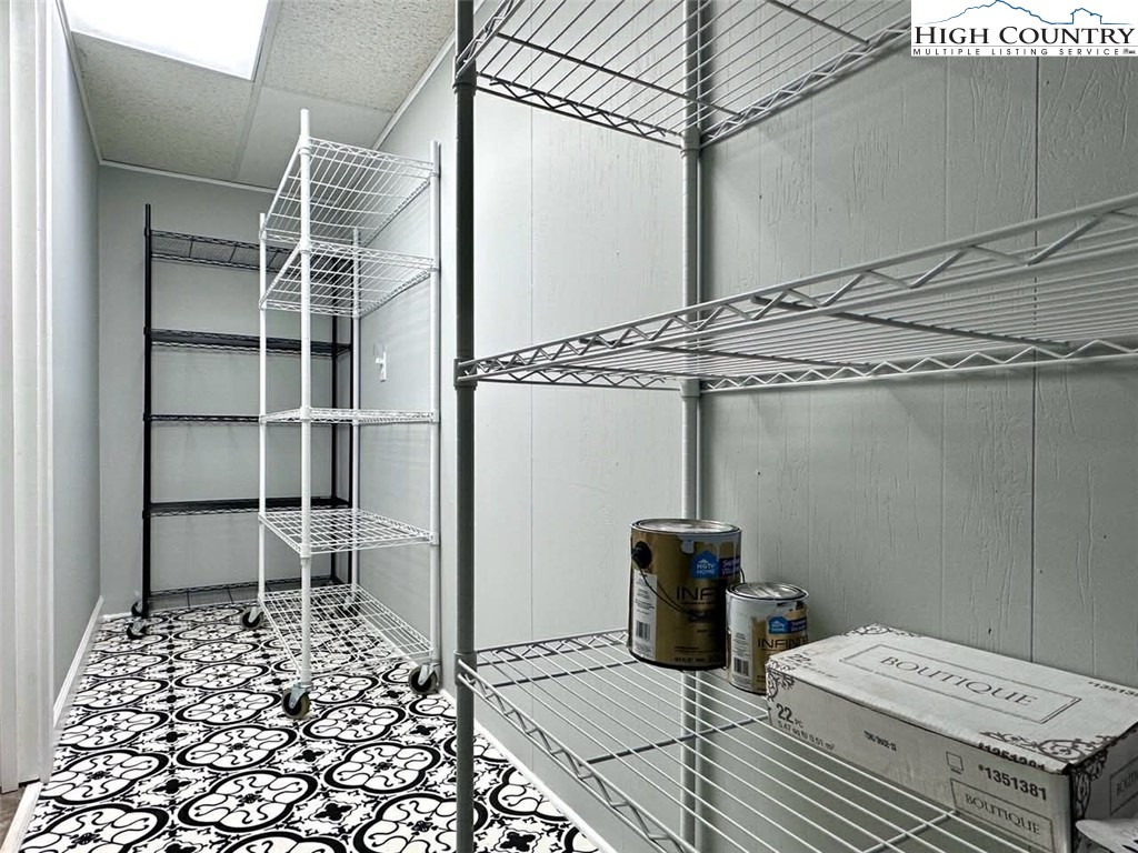 223 Timberlake Sparta, NC 28675 - Photo 45 of 50 a bedroom with a bed and a table