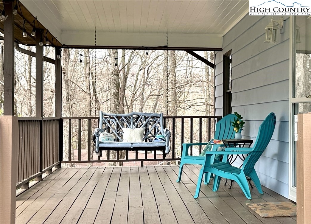 223 Timberlake Sparta, NC 28675 - Photo 5 of 50 a view of a chairs on wooden deck