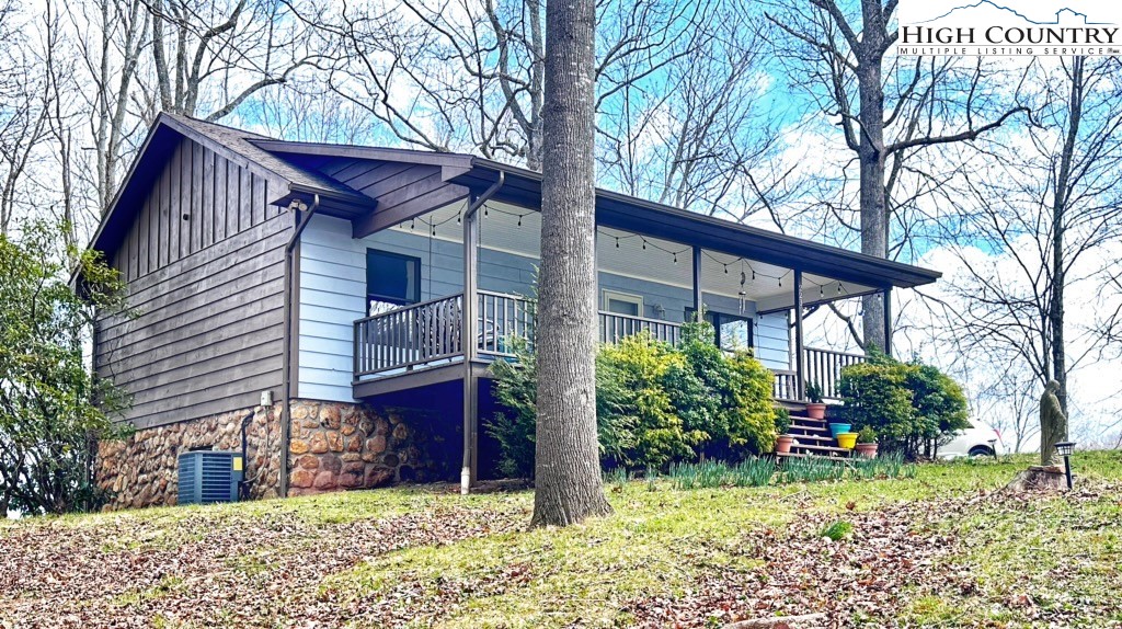 223 Timberlake Sparta, NC 28675 - Photo 6 of 50 a view of a house with a yard