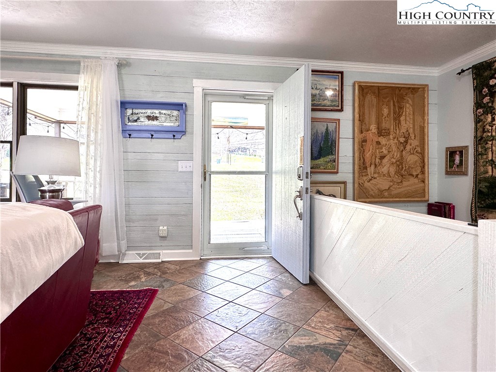 223 Timberlake Sparta, NC 28675 - Photo 7 of 50 a spacious bedroom with a bed and a window