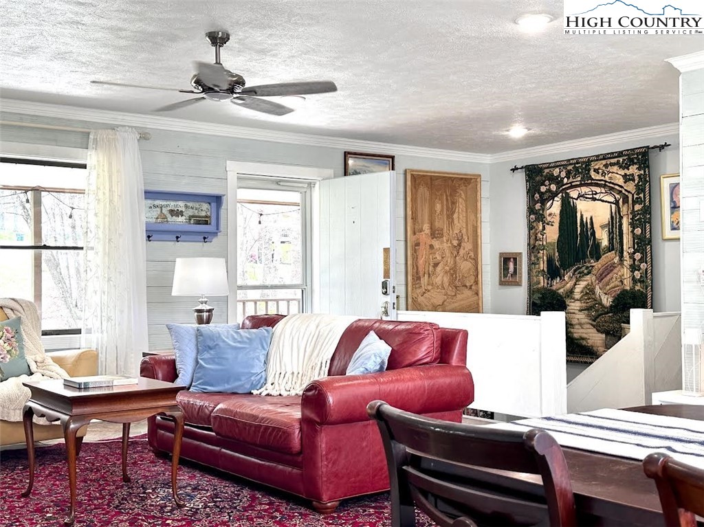 223 Timberlake Sparta, NC 28675 - Photo 8 of 50 a living room with furniture a flat screen tv and a window