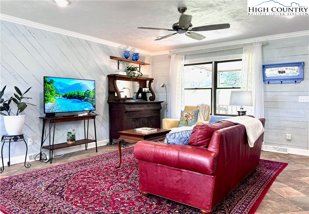 223 Timberlake Sparta, NC 28675 - Photo 10 of 50 a living room with furniture and a flat screen tv