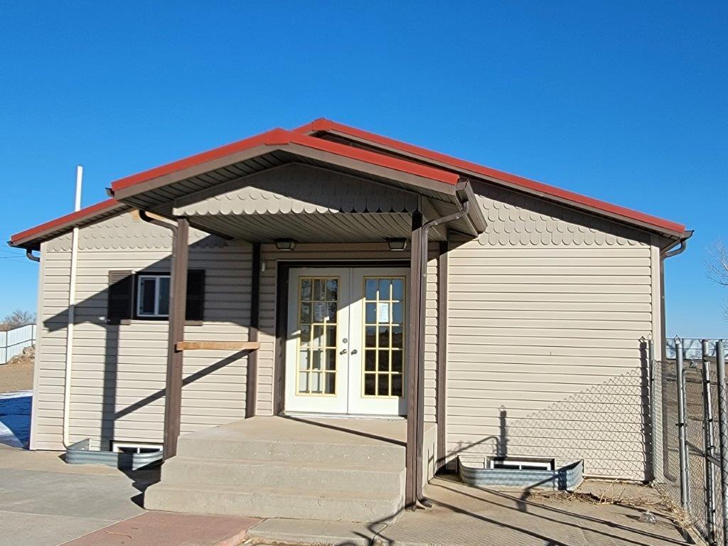 2034 County Rd LL Wiley, CO 81092 - Photo 1 of 29 a view of a house with large windows