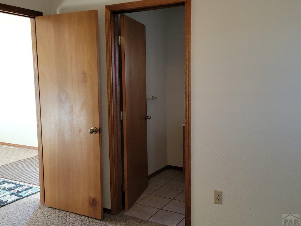 2034 County Rd LL Wiley, CO 81092 - Photo 12 of 29 a view of a bathroom from the hallway