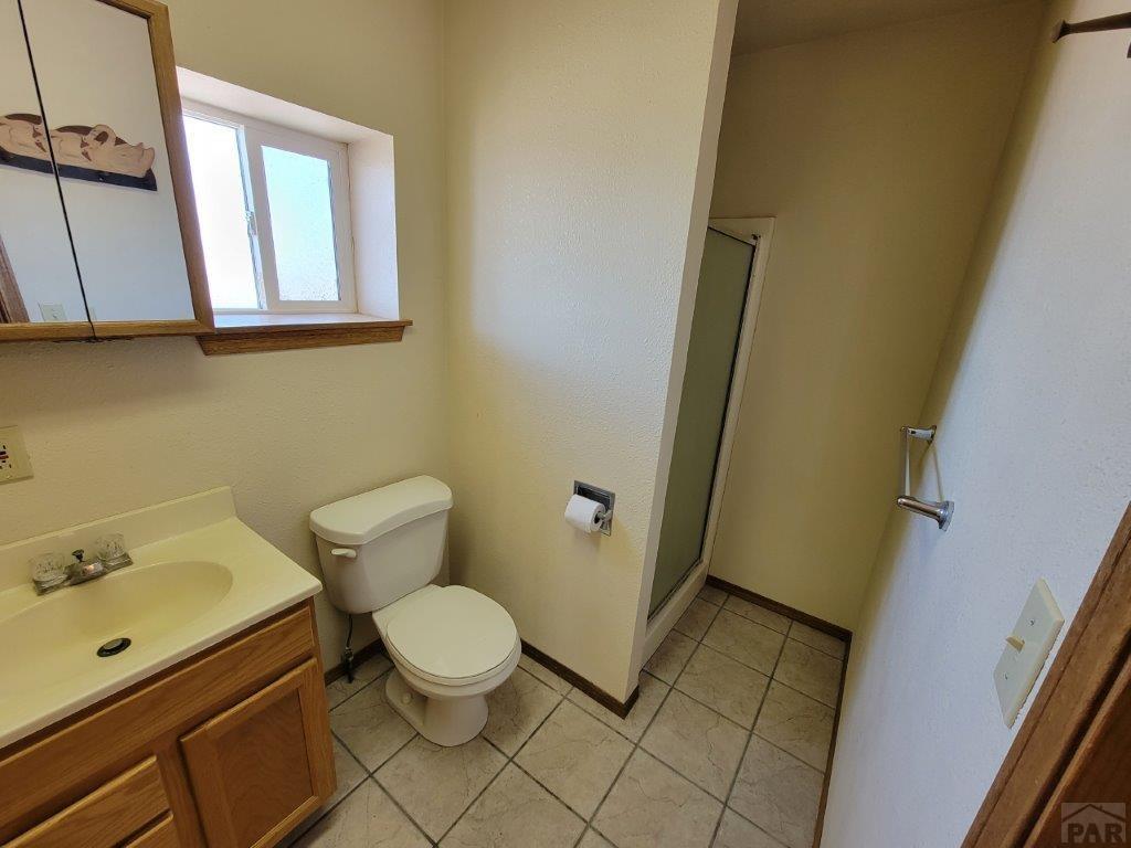 2034 County Rd LL Wiley, CO 81092 - Photo 13 of 29 a bathroom with a sink and a toilet