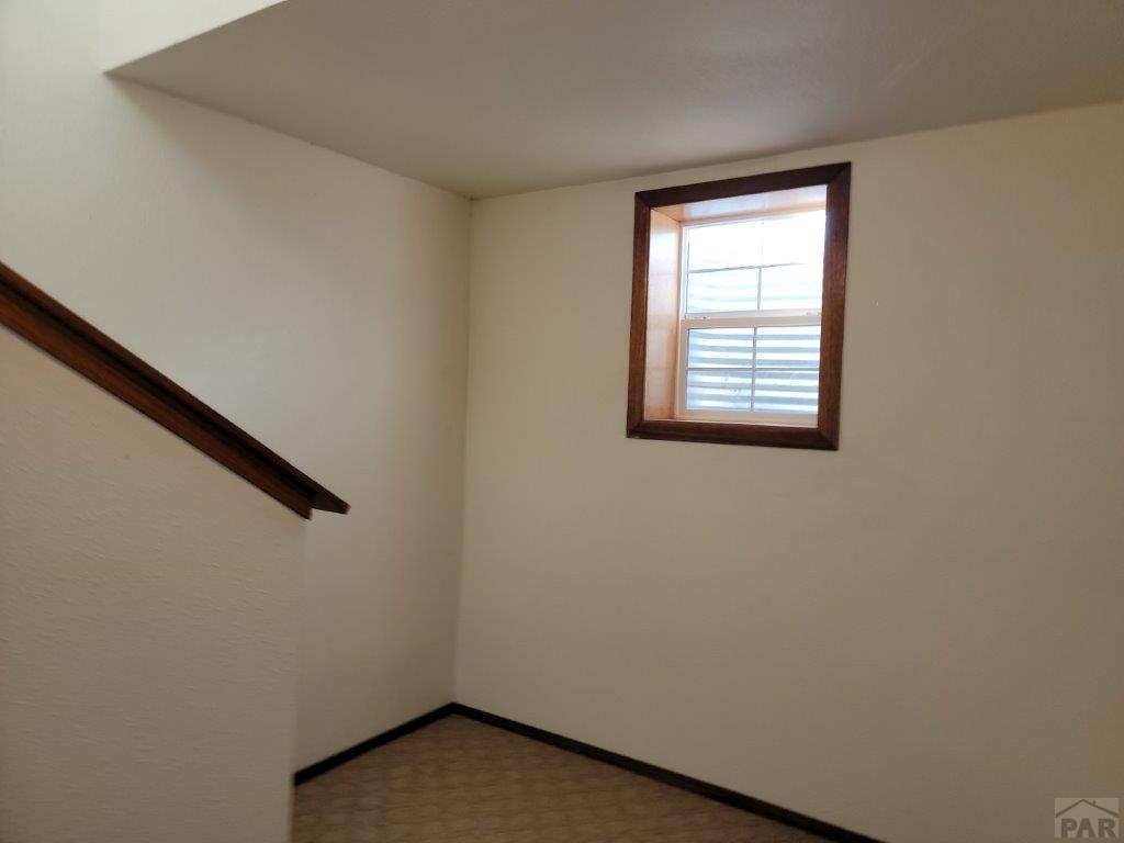 2034 County Rd LL Wiley, CO 81092 - Photo 15 of 29 an empty room with a window