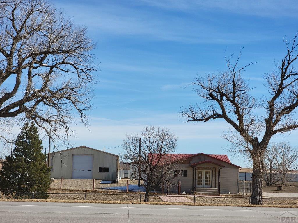 2034 County Rd LL Wiley, CO 81092 - Photo 2 of 29 a view of a house and a yard
