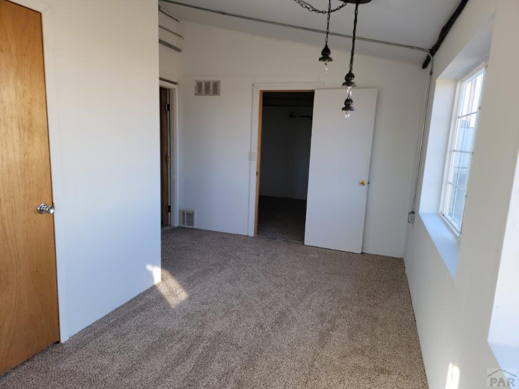 2034 County Rd LL Wiley, CO 81092 - Photo 24 of 29 a view of empty room with windows