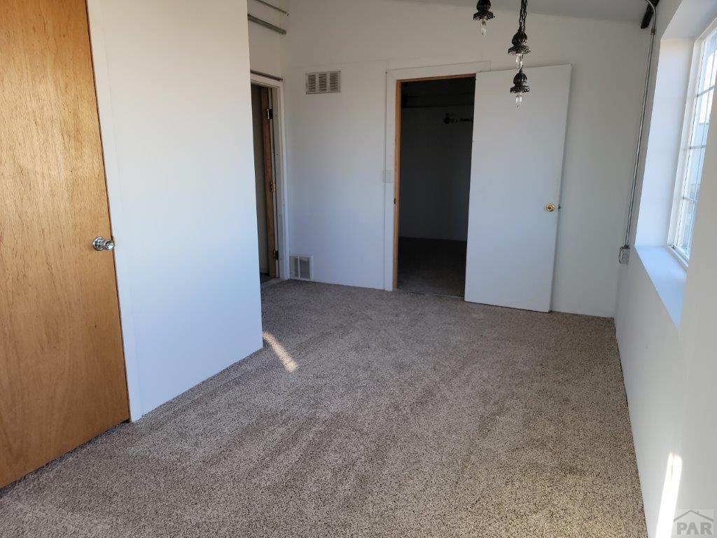 2034 County Rd LL Wiley, CO 81092 - Photo 25 of 29 an empty room with closet