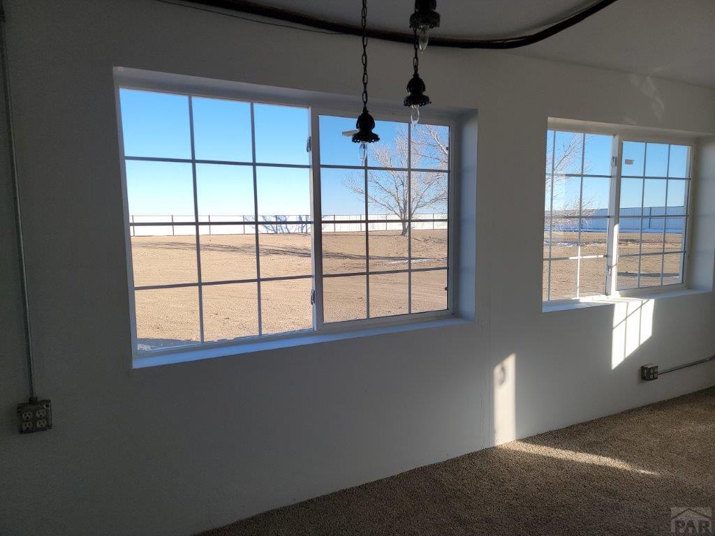 2034 County Rd LL Wiley, CO 81092 - Photo 27 of 29 a view of an empty room with a window