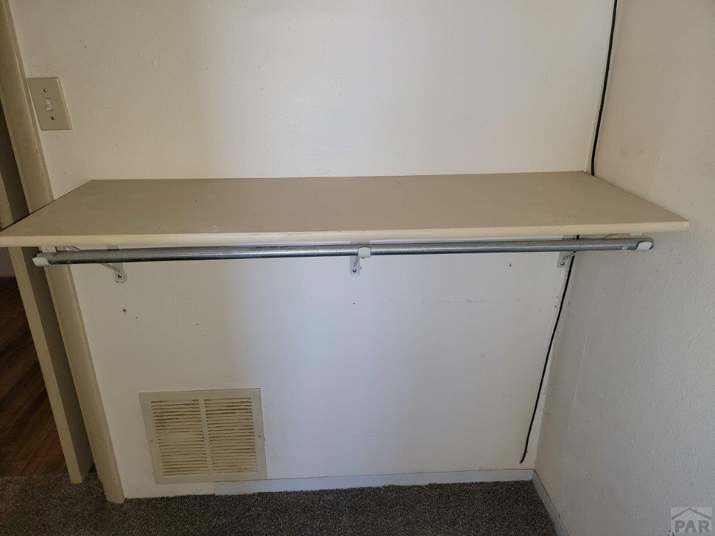 2034 County Rd LL Wiley, CO 81092 - Photo 28 of 29 a view of small space with racks on the wall
