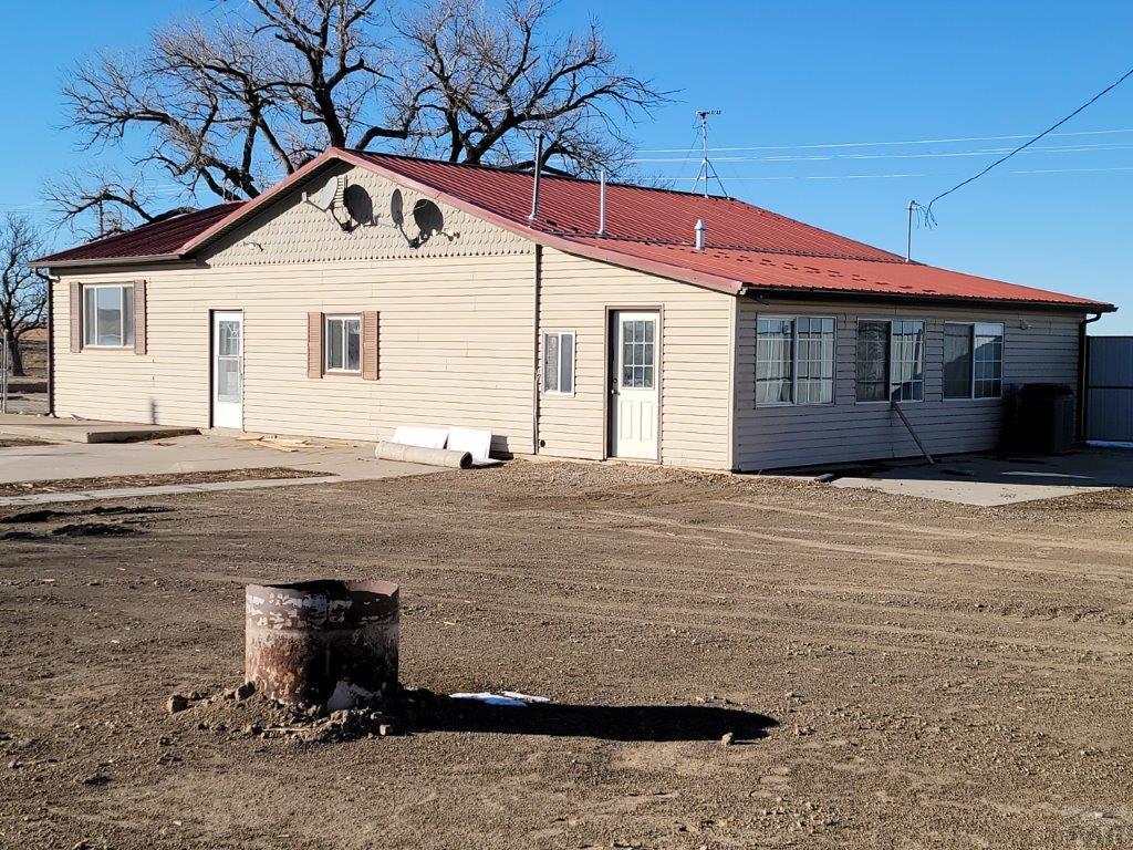 2034 County Rd LL Wiley, CO 81092 - Photo 4 of 29 a front view of a house with a yard