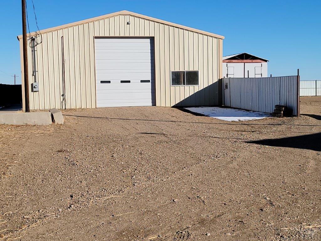 2034 County Rd LL Wiley, CO 81092 - Photo 7 of 29 a front view of a house with a yard