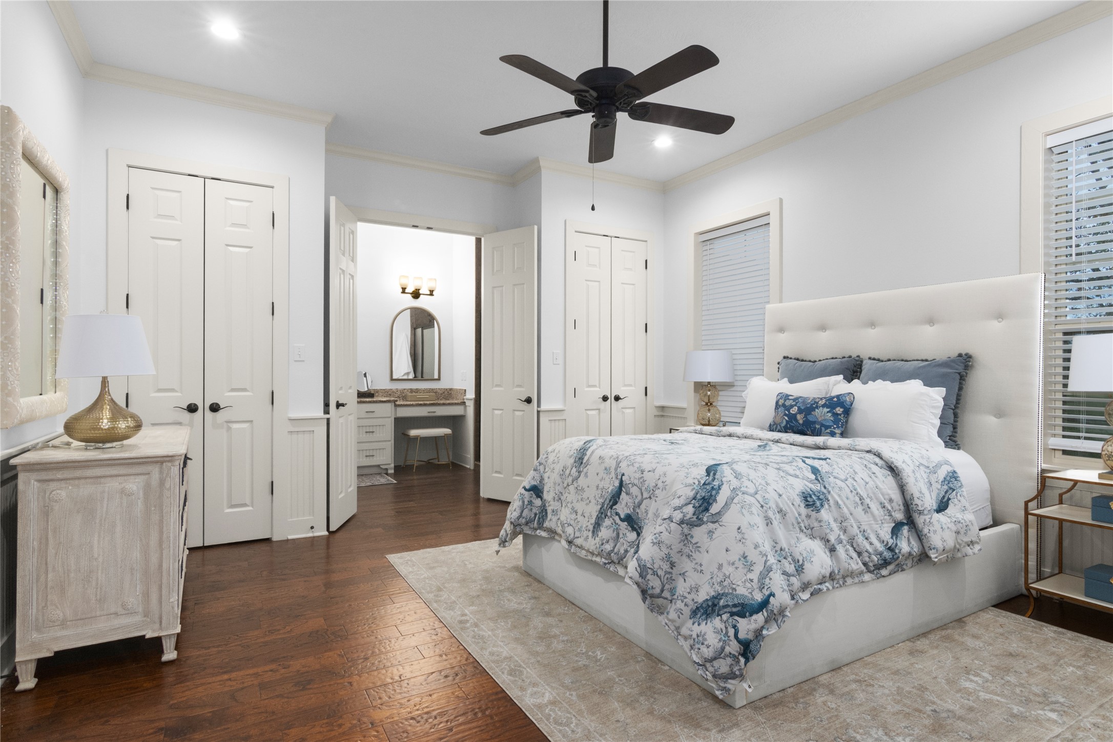 6130 Homeland Lane Brenham, TX 77833 - Photo 17 of 33 a spacious bedroom with a bed and a chandelier