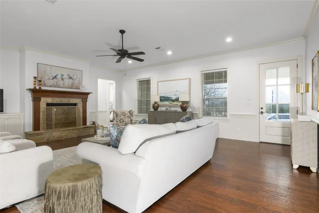 a living room with furniture a fireplace and a fireplace