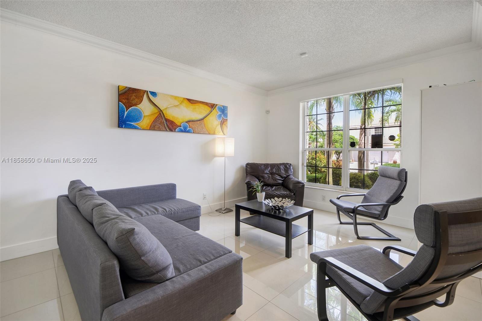18196 Southwest 29th Street Miramar, FL 33029 - Photo 11 of 54 a living room with furniture and a window