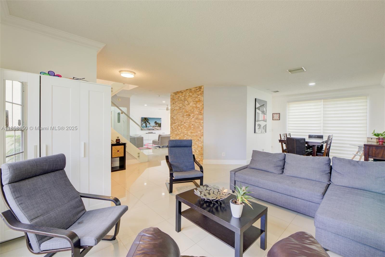 18196 Southwest 29th Street Miramar, FL 33029 - Photo 14 of 54 a living room with furniture and a large window