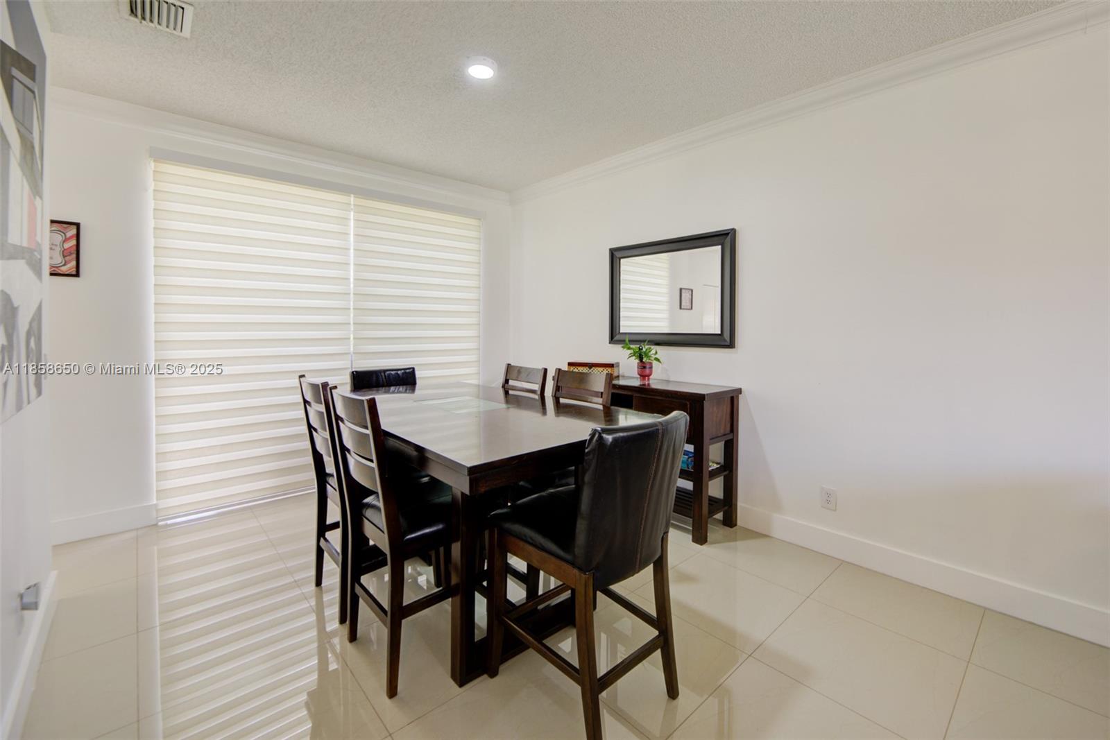 18196 Southwest 29th Street Miramar, FL 33029 - Photo 15 of 54 a view of a dining room with furniture and window