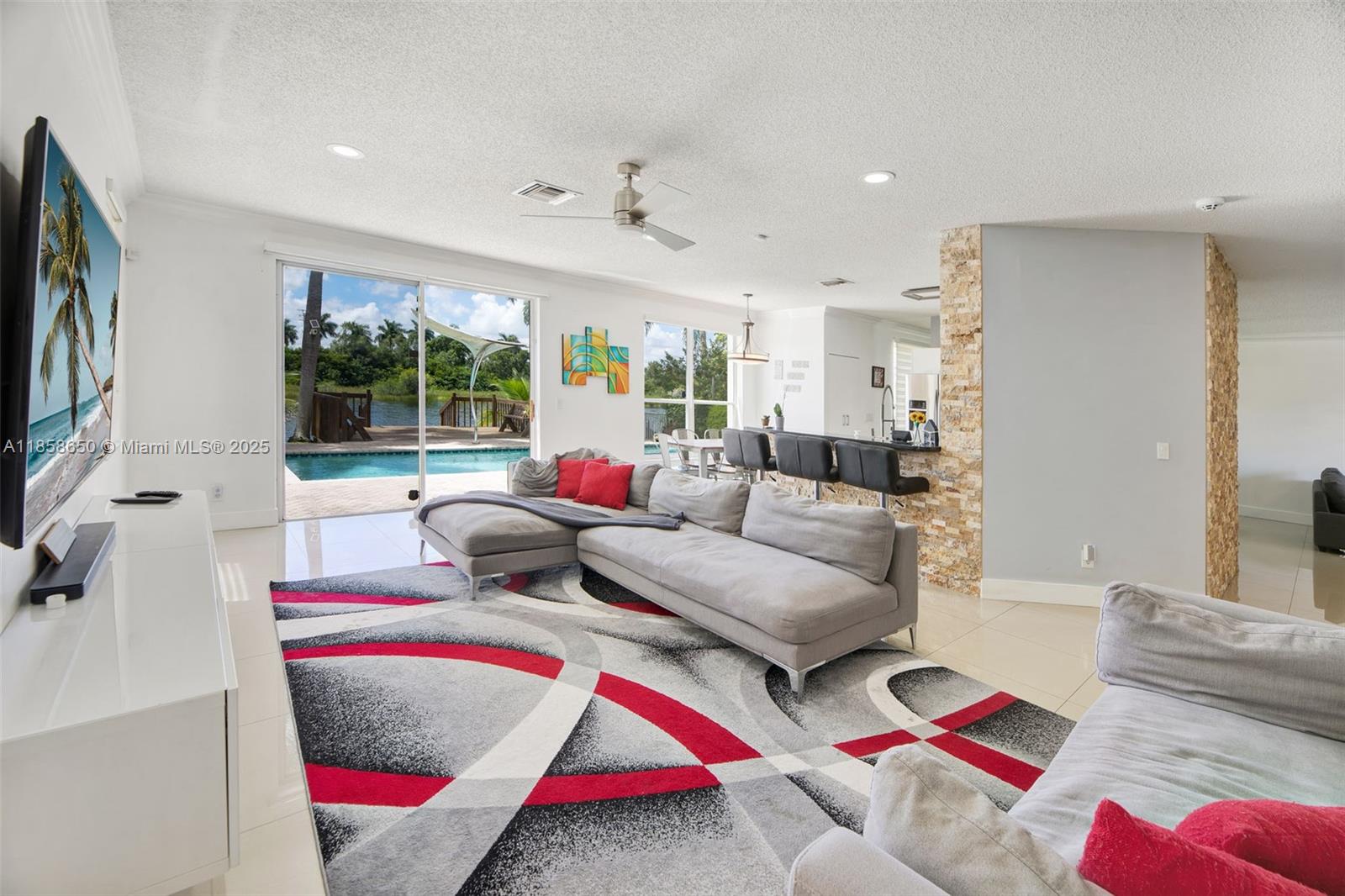 18196 Southwest 29th Street Miramar, FL 33029 - Photo 19 of 54 a living room with furniture and a flat screen tv