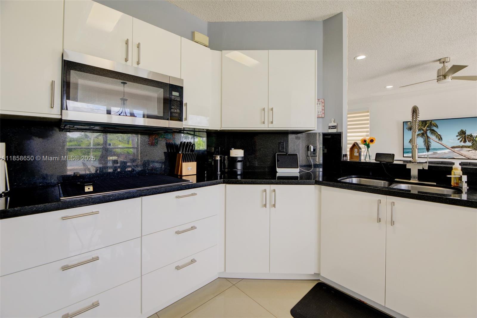 18196 Southwest 29th Street Miramar, FL 33029 - Photo 24 of 54 a kitchen with white cabinets and appliances