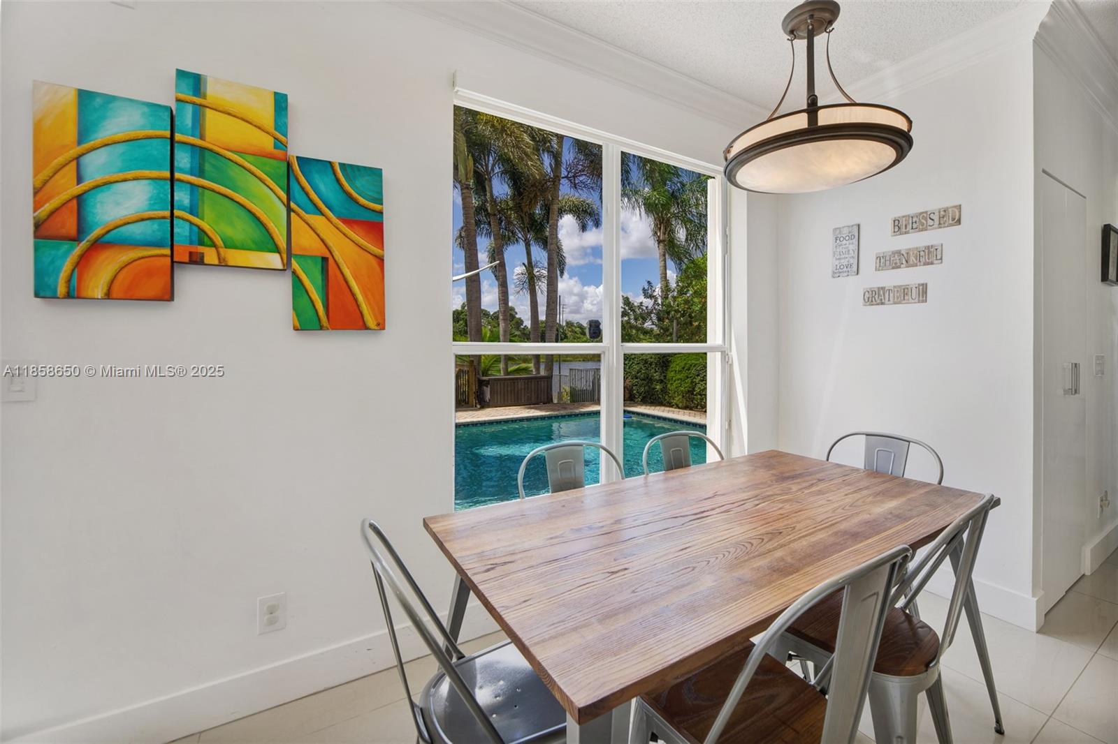18196 Southwest 29th Street Miramar, FL 33029 - Photo 27 of 54 a view of a dining room with furniture one side kitchen view and wooden floor