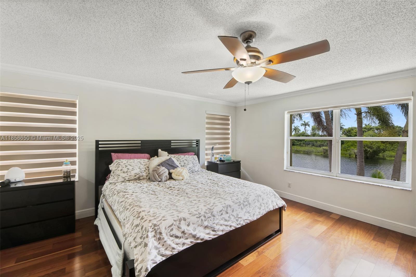 18196 Southwest 29th Street Miramar, FL 33029 - Photo 28 of 54 a bedroom with a large bed and a large window