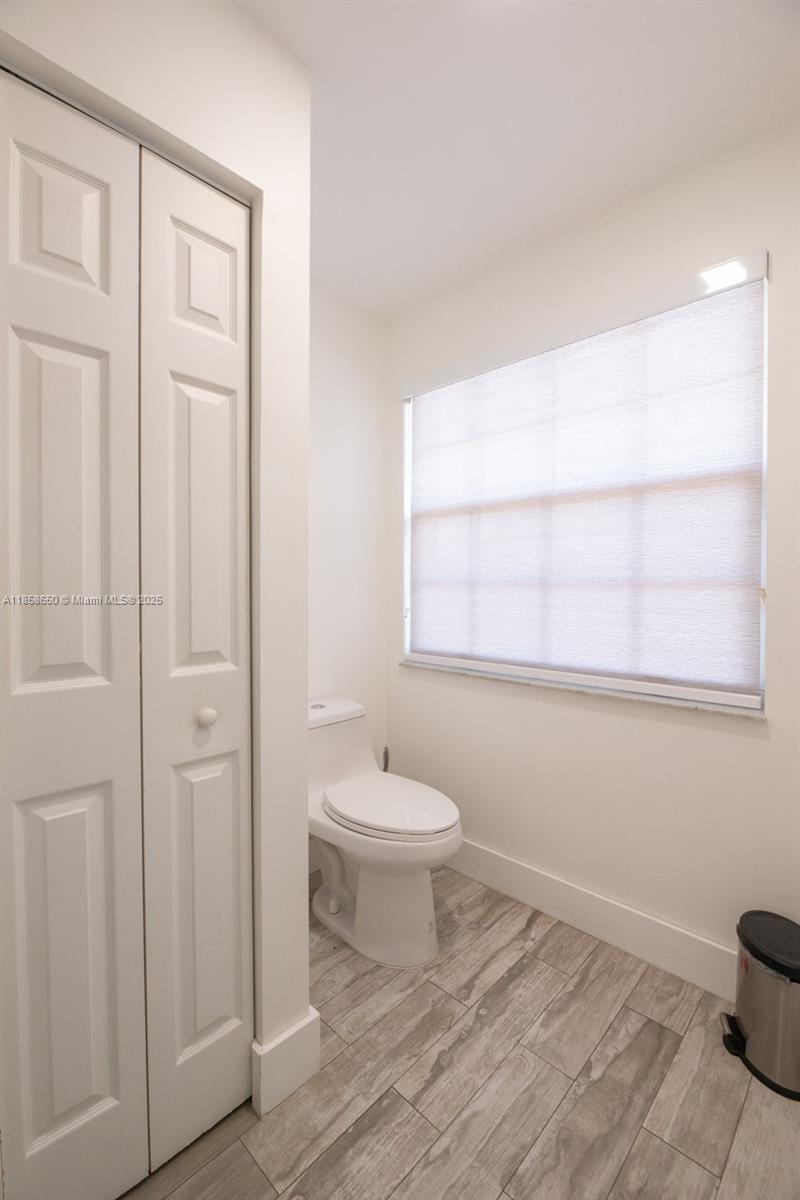 18196 Southwest 29th Street Miramar, FL 33029 - Photo 33 of 54 a bathroom with a sink a toilet and shower