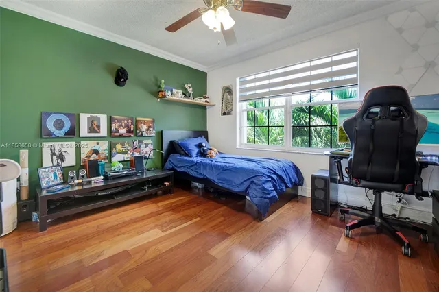 a bed room with a bed and a chair