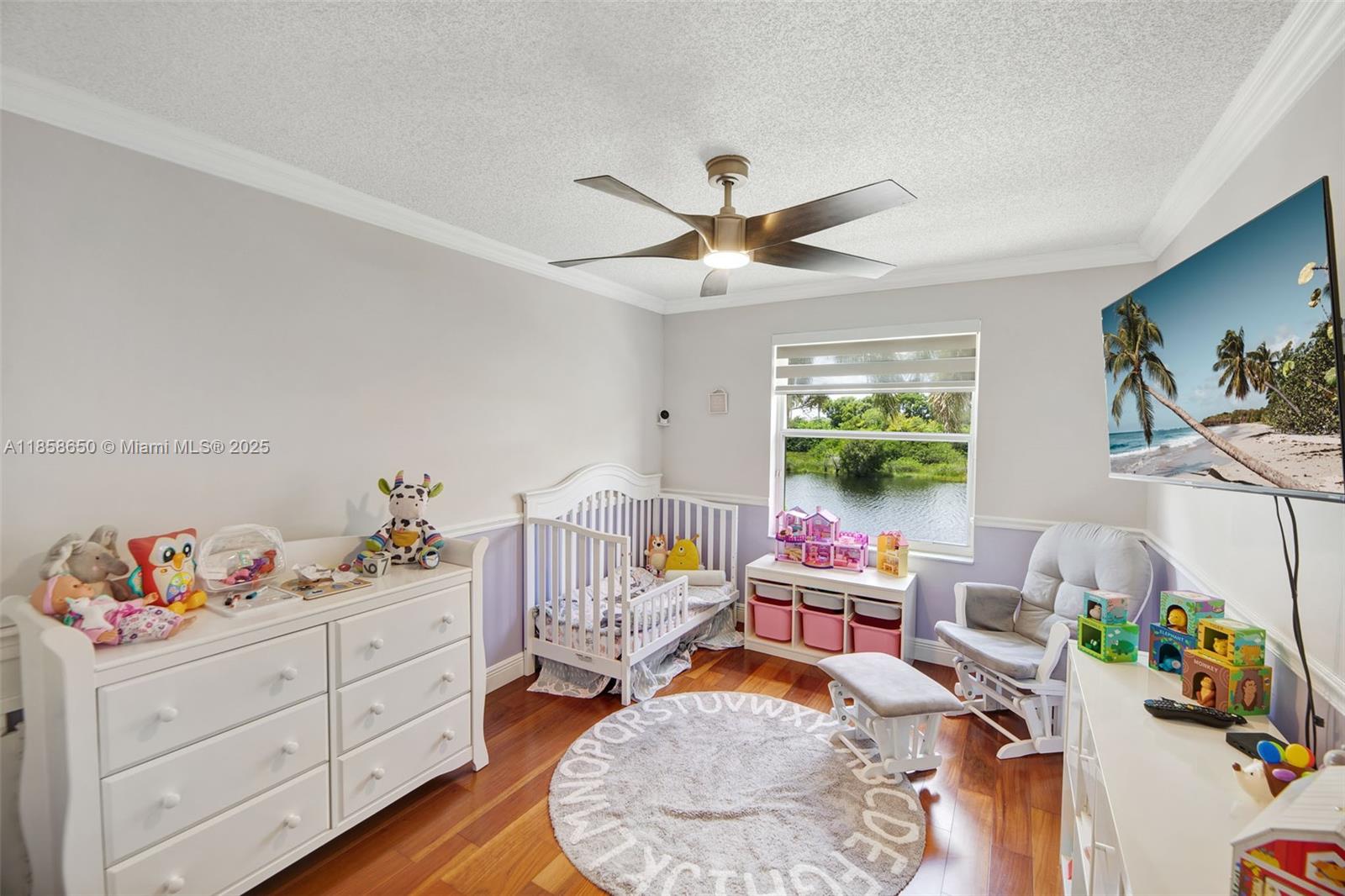 18196 Southwest 29th Street Miramar, FL 33029 - Photo 39 of 54 a bedroom with furniture toys ceiling fan and a window