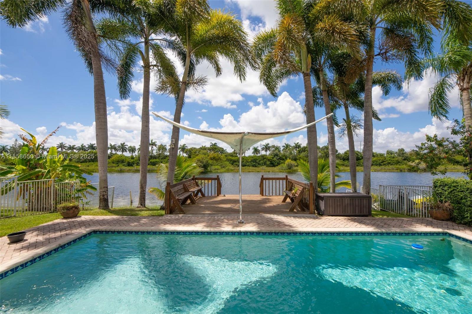 18196 Southwest 29th Street Miramar, FL 33029 - Photo 45 of 54 a view of swimming pool with a table and chairs