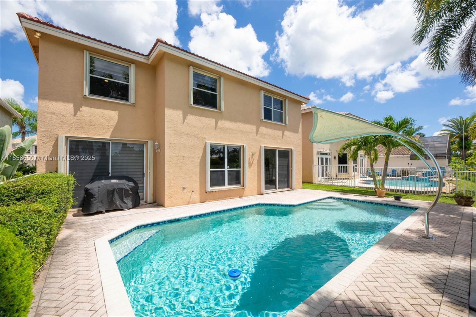 18196 Southwest 29th Street Miramar, FL 33029 - Photo 47 of 54 a view of a house with a yard and sitting area