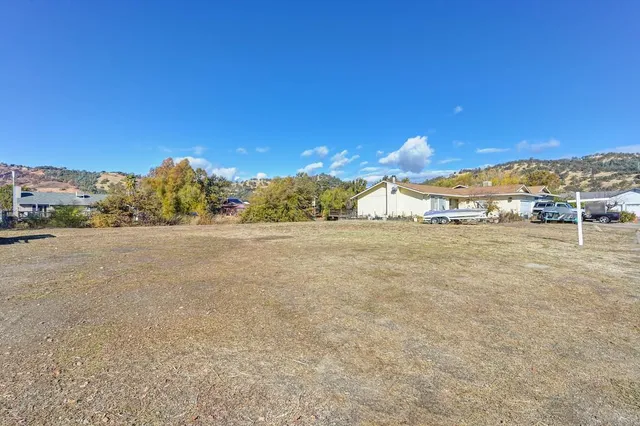 a view of a field with ocean view