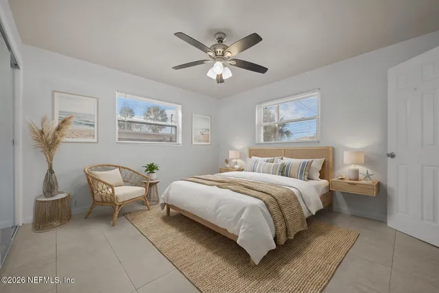 a bed room with a bed and a chair