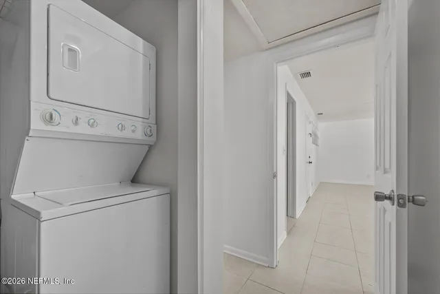 a view of bathroom with a washer and dryer