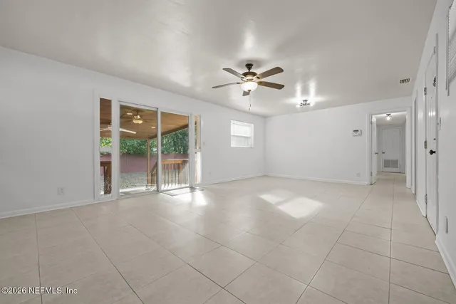 a view of an empty room with a window