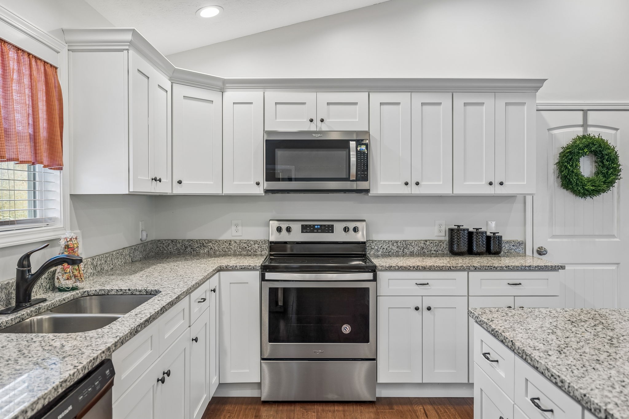 2 Hickman Creek Road North Hickman, TN 38567 - Photo 13 of 31 a kitchen with granite countertop white cabinets white stainless steel appliances and a sink