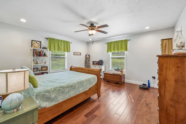 a bed room with a bed and a window